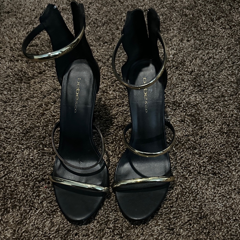 Bebe Elegant Black Heels with Gold Accents